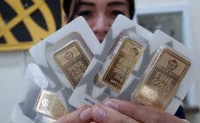 Harga Emas Antam Turun ke Rp909 Ribu per Gram Harga Emas Antam Turun ke Rp909 Ribu per Grami
